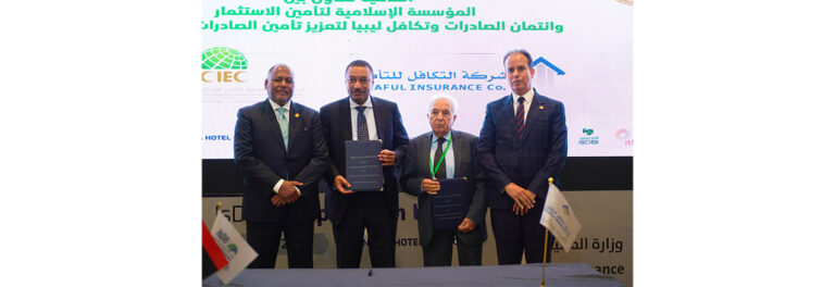 Officials signing agreement at event.